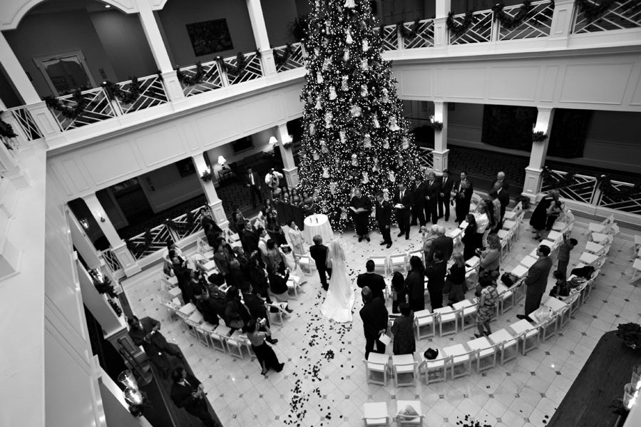 glittering Christmas tree is a beautiful backdrop to a wedding ceremony