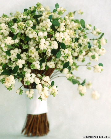White berries are a delicate addition to a bridal bouquet
