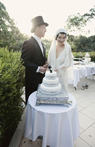 Ebony created the three tier wedding cake with an art deco style cake topper