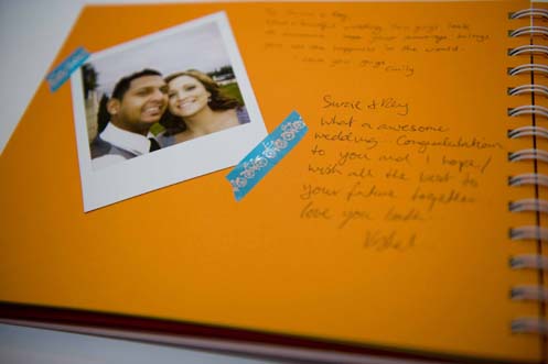  Polaroids and stuck them into a book to act as the couple's guest book