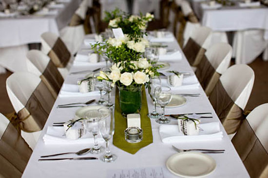 The ceremony was decorated with olive green table runners and masses of 