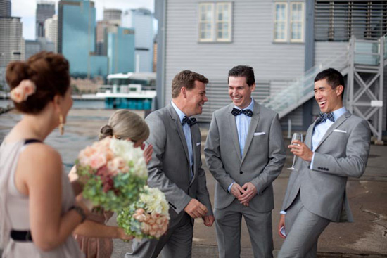 The groom and groomsmen wore suits from Roger David with bow ties from Beau