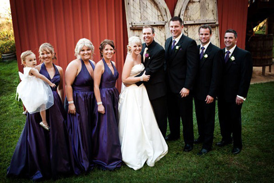 Courtney's bridesmaids wore purple halterneck gowns The groom and groomsmen